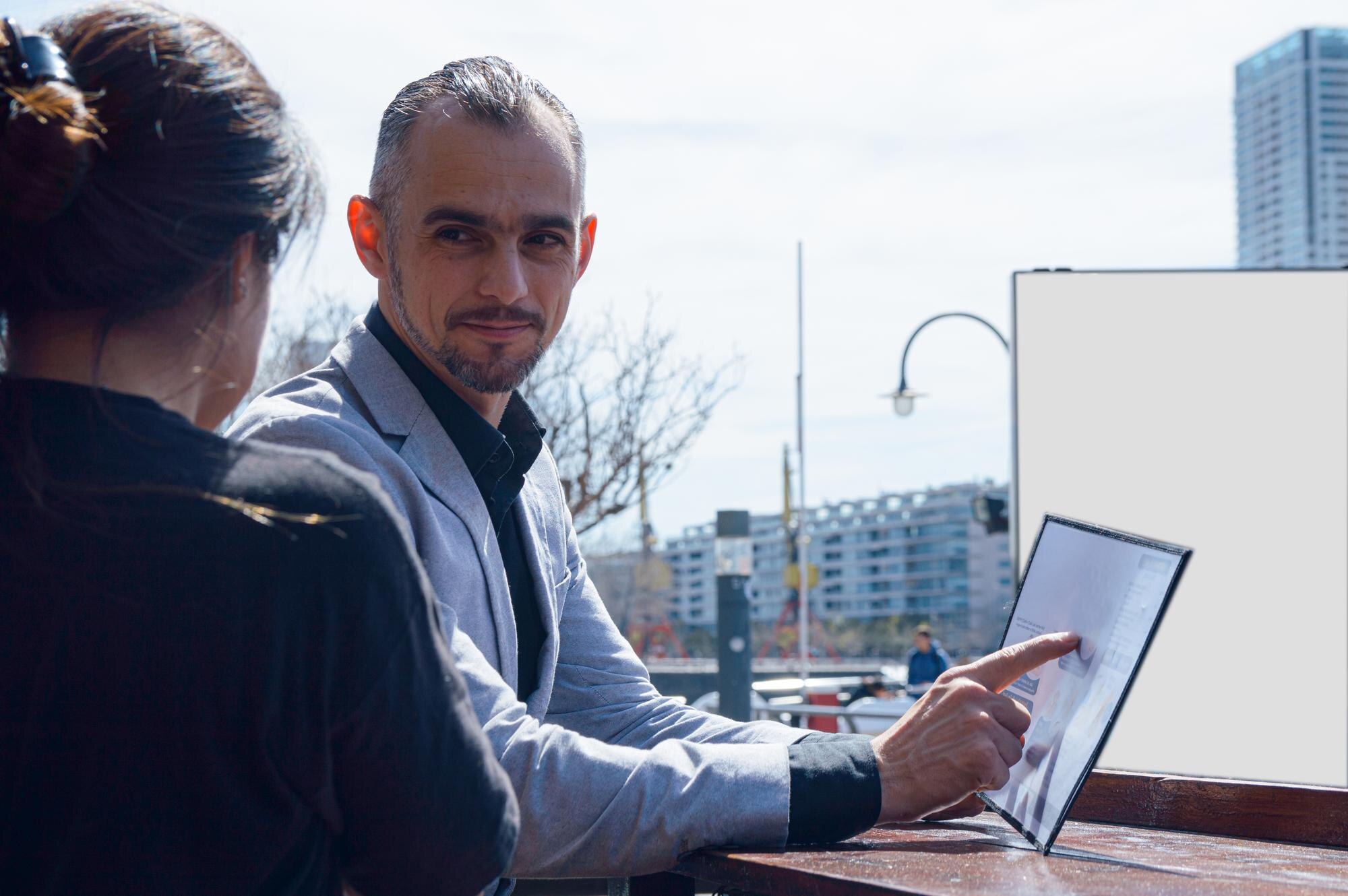Local business team reviewing SEO services for local businesses and lead performance on a laptop.